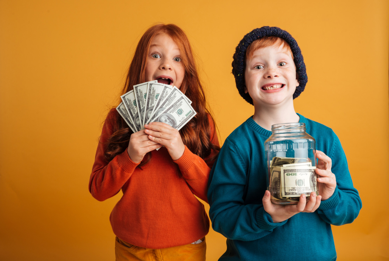 excited-little-redhead-children-holding-money